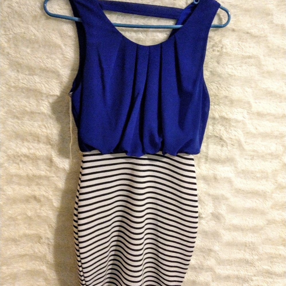 Blue dress, with black and white skirt, gives body